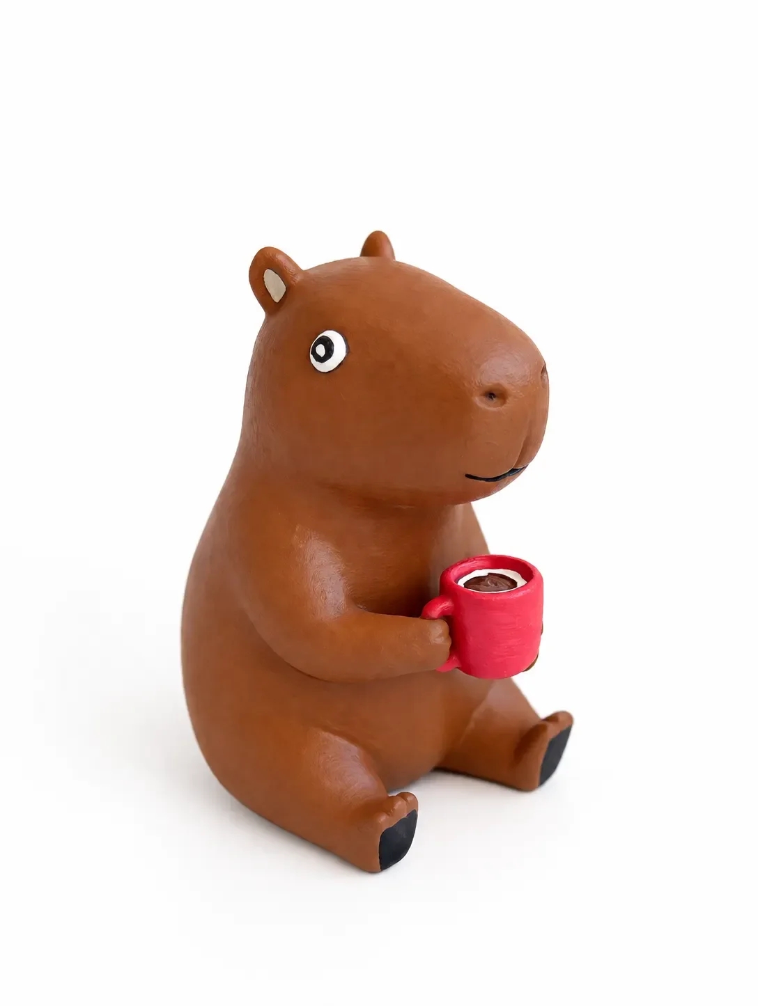 Capivara com caneca de café